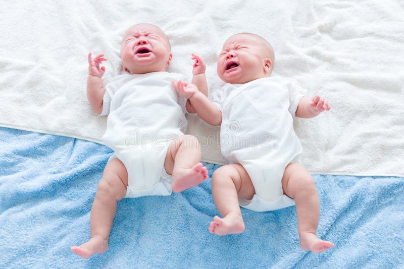 Baby twins cry stock image. Image of male, living, adorable 41803509