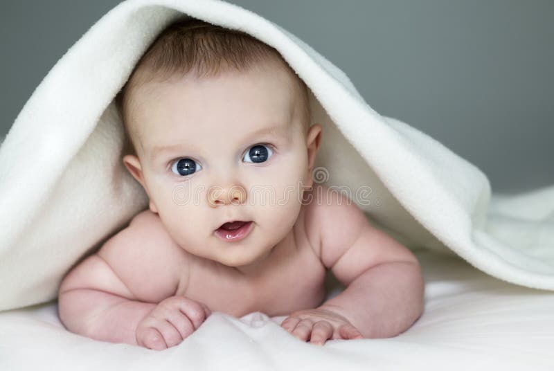 Baby under blanket stock image. Image of healthy, beauty 86457339