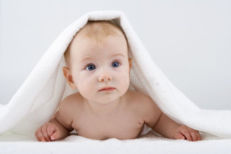 Baby under towel.