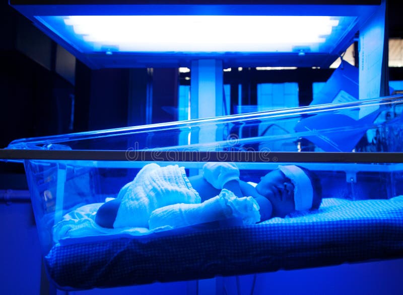 Baby Under Ultraviolet Lamp royalty free stock photo