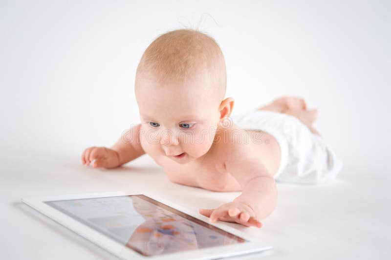 Baby using digital tablet royalty free stock image