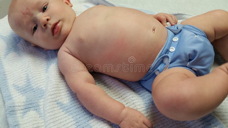Baby Wearing Blue Cloth Diaper stock photo Baby Wearing Blue Cloth Diaper stock photo