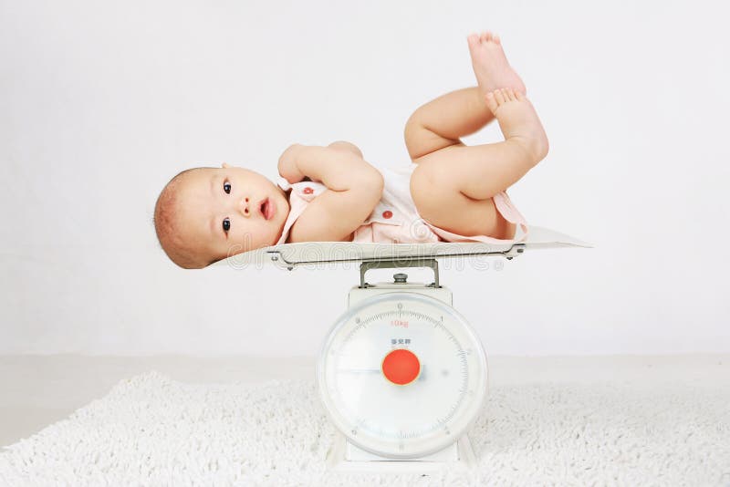 Newborn Baby On Weighing Scale Stock Photo, Picture and Royalty Free Image.  Image 24134897.