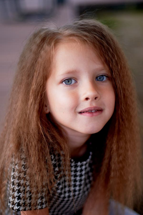 The Baby is 4 Years Old, with Blue Eyes and Small Curls. Children`s ...