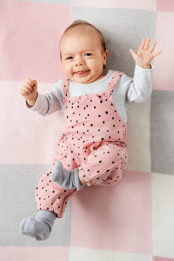 Sweet Baby Girl in Pink Suit Lying on Blanket Stock Image - Image of ...