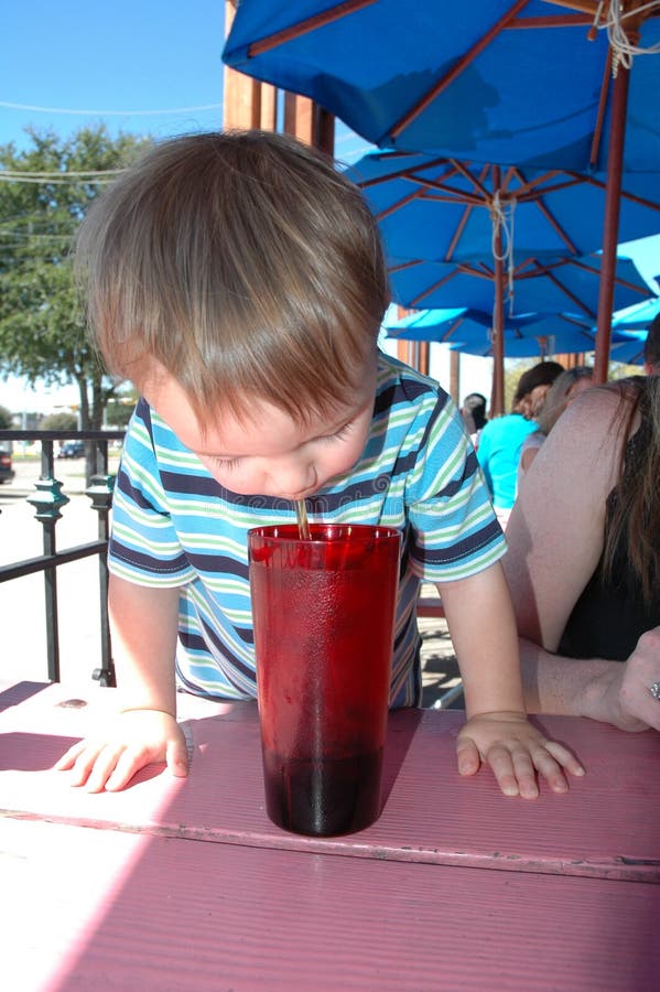 Boy drinking soda stock image. Image of little, black 8263385