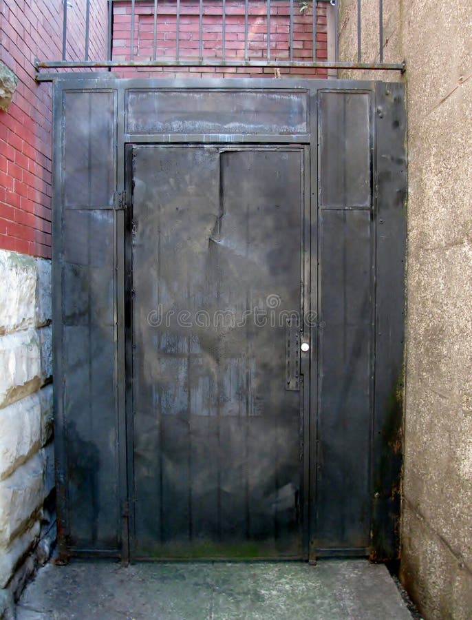 Back alley metal door. stock photo. Image of closed, city 99562488