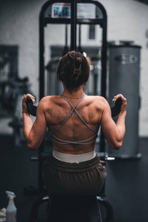 Back of the Girl Working Out in the Gym. Stock Photo Image of sport