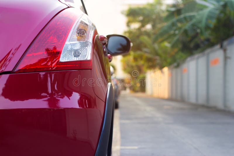 Back Light of Sport Car after the Rain on the Street Background Stock