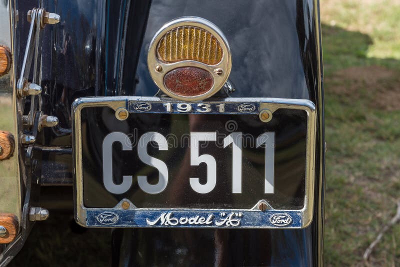 VILLIERSDORP, SOUTH AFRICA - APRIL 12, 2021: Back lights and number plate of a vintage Ford Model A deluxe roadster from 1931. VILLIERSDORP, SOUTH AFRICA - APRIL 12, 2021: Back lights and number plate of a vintage Ford Model A deluxe roadster from 1931