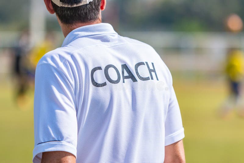 Back of Sport Coach Wearing COACH Shirt at an Outdoor Sport Field ...