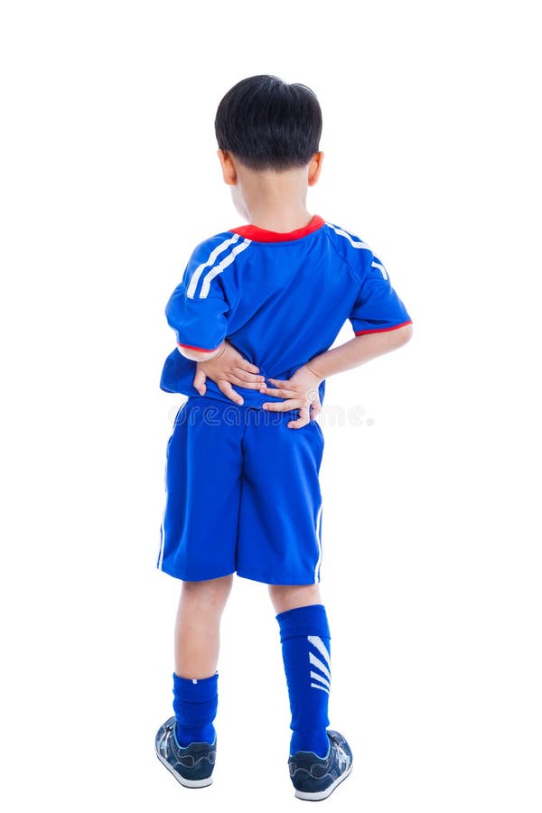 Back pain. Athlete little asian &#x28;thai&#x29; boy in blue sportswear standing and rubbing the muscles of his lower back, isolated on white background. Studio shot. Back pain. Athlete little asian &#x28;thai&#x29; boy in blue sportswear standing and rubbing the muscles of his lower back, isolated on white background. Studio shot