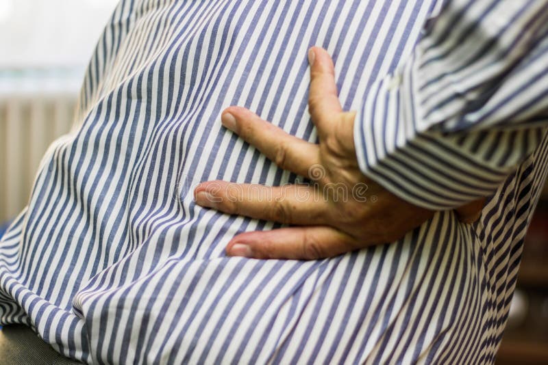 Back pain stock photo. Image of cramp, condition, mature - 97560154