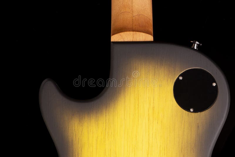 Back Part of the Body of an Electric Guitar on Black Background Stock