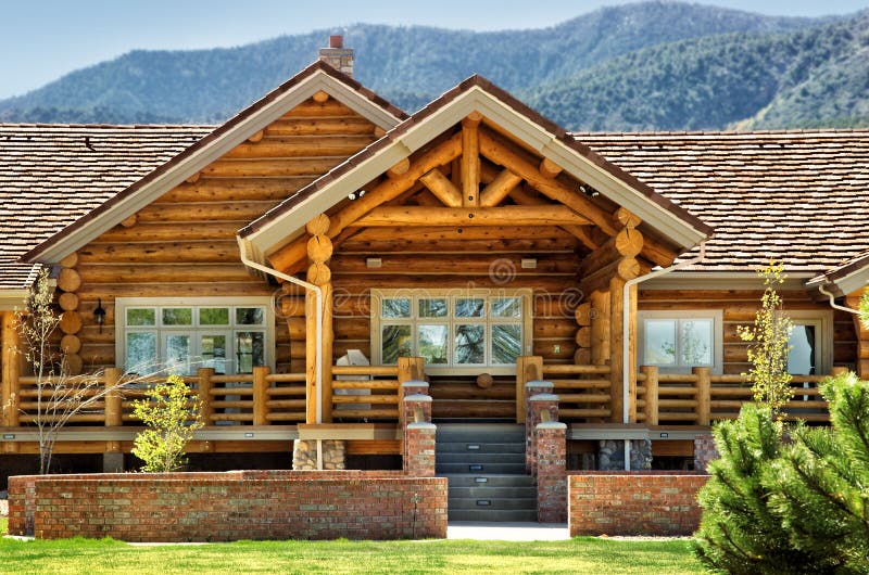 The back patio area of a modern Log home.