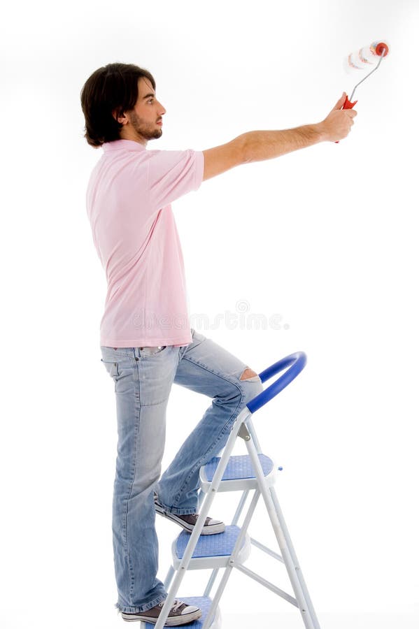 Back pose of man with paint roller