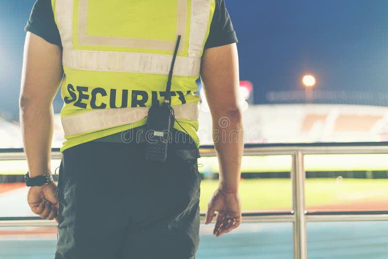 Back of Security Standing in the Soccer Stadium. Stock Photo Image of