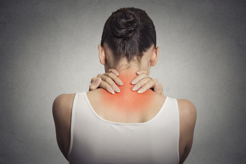 Back spine disease. Closeup view tired female massaging her neck stock photography Back spine disease. Closeup view tired female massaging her neck stock photography
