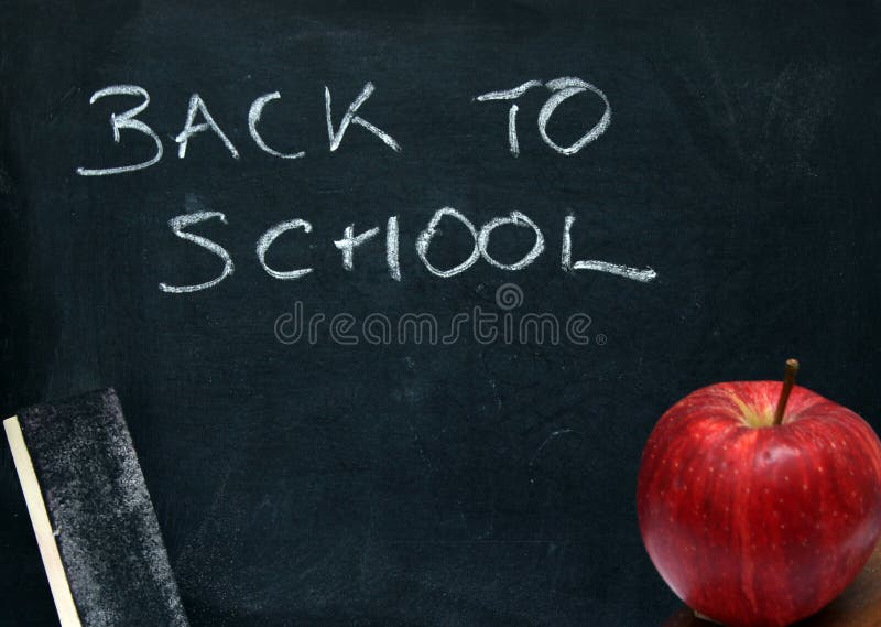 Chalk board and apple with writing back to school