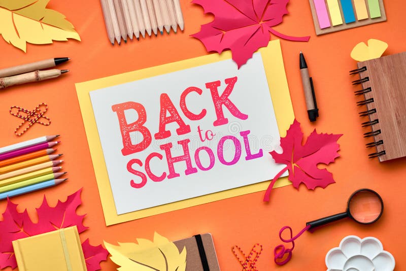 Back to school, flat lay on dark texture background with stationary and decorative paper Autumn leaves, text \"Back to school. Back to school, flat lay on dark texture background with stationary and decorative paper Autumn leaves, text \"Back to school