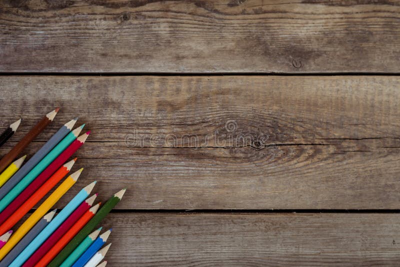 Back To School Concept Background with Colored Pencils on Wooden Table