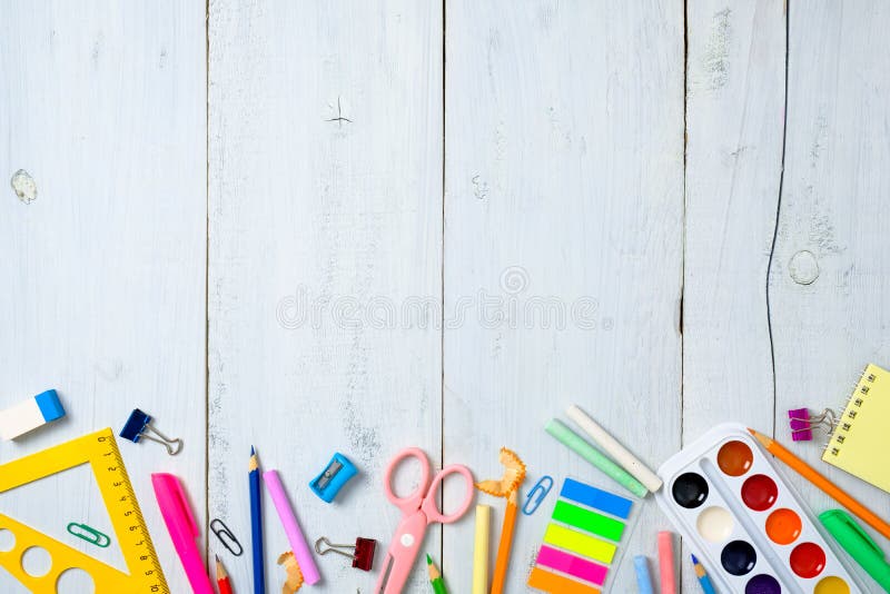 Back to school concept, border frame of colorful stationery supplies for teaching kids drawing on empty white wooden desk.