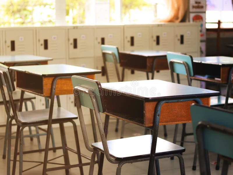 Education , back to school concept.Empty elementary class room  with chairs ,tables and student lockers