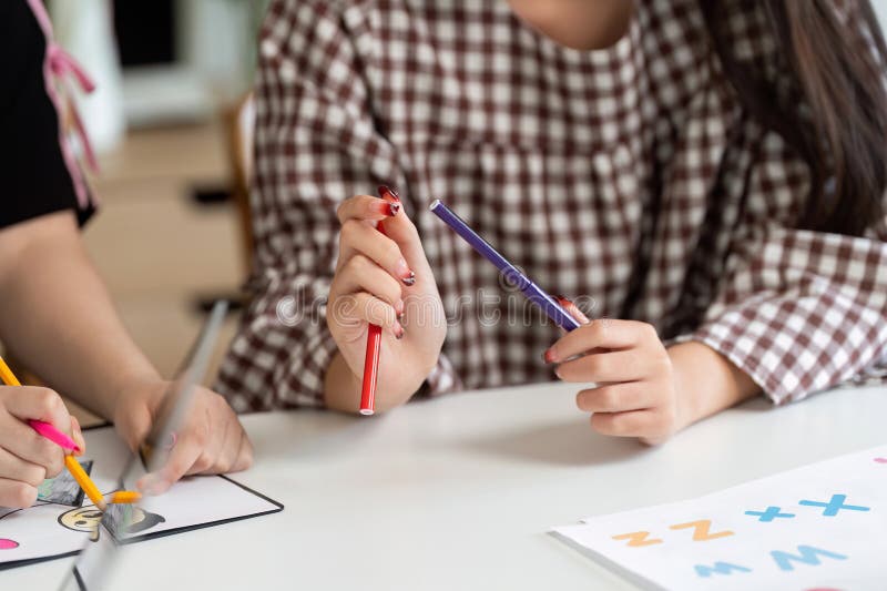 Back to School creative activities with students drawing and coloring stock photography