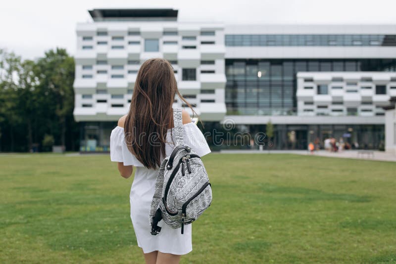 Back to school. Cute teenage girl with backpack running and going to school with fun. Happy woman student,Education