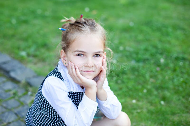 Back to school. Education Concept Preschool Education. Close-up portrait. Child schoolgirls looking at camera. Charming schoolgirl stock photo Back to school. Education Concept Preschool Education. Close-up portrait. Child schoolgirls looking at camera. Charming schoolgirl stock photo