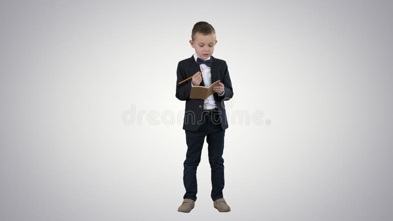 Back to school Little boy putting down ideas on gradient background.