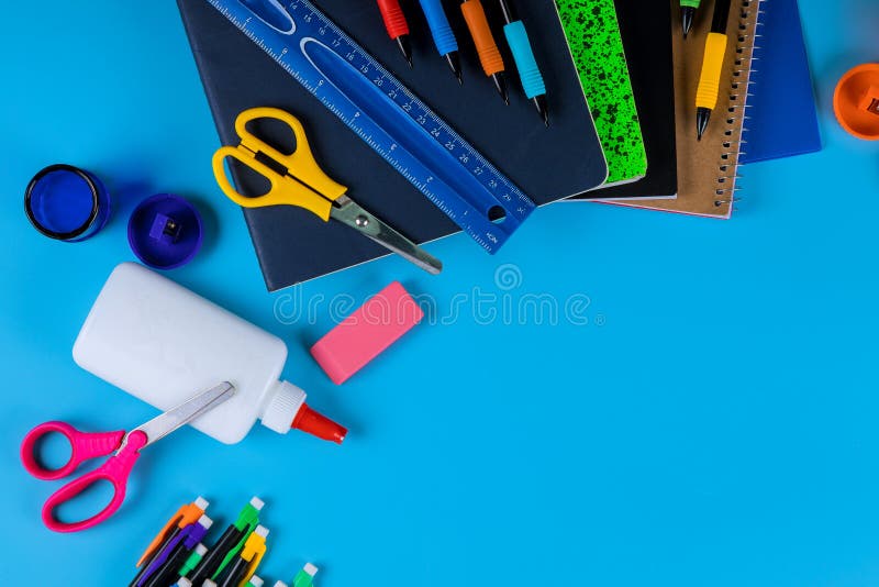 Back to school , school supplies on light blue background stock photos Back to school , school supplies on light blue background stock photos