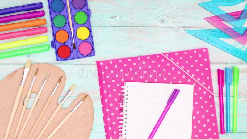 Back to school stop motion. School supplies appear on wooden table