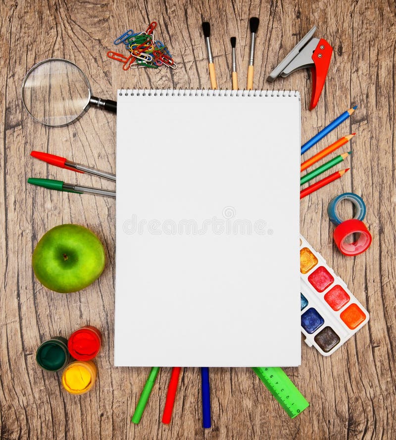 Back to school. Writing tools. On a wooden background. Back to school. Writing tools. On a wooden background.