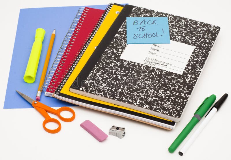 Notepads and paper with pens, pencil, highlighter, eraser, scissors, and sharpener on light gray background. Notepads and paper with pens, pencil, highlighter, eraser, scissors, and sharpener on light gray background