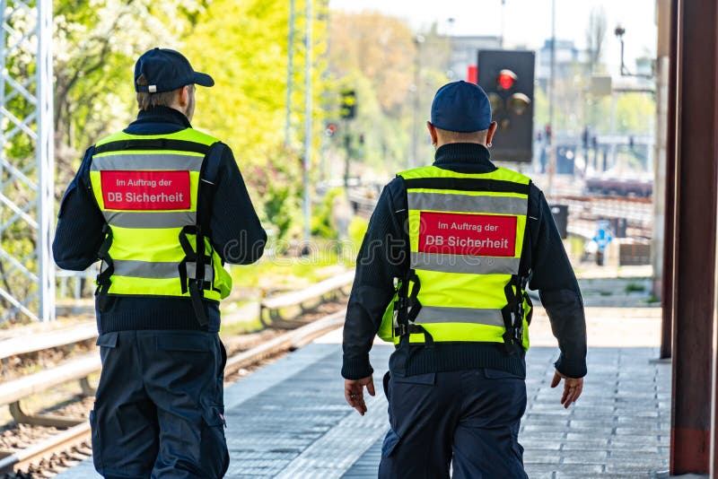 Berlin, Germany - April 18, 2019: Back turned DB Sicherheit officers