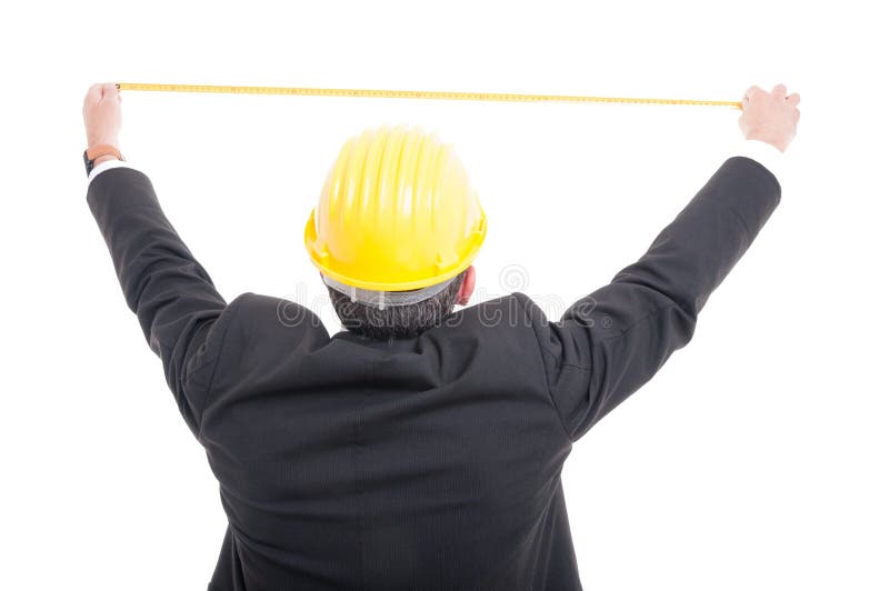 Back view of architect posing measuring with ruler tape stock photography