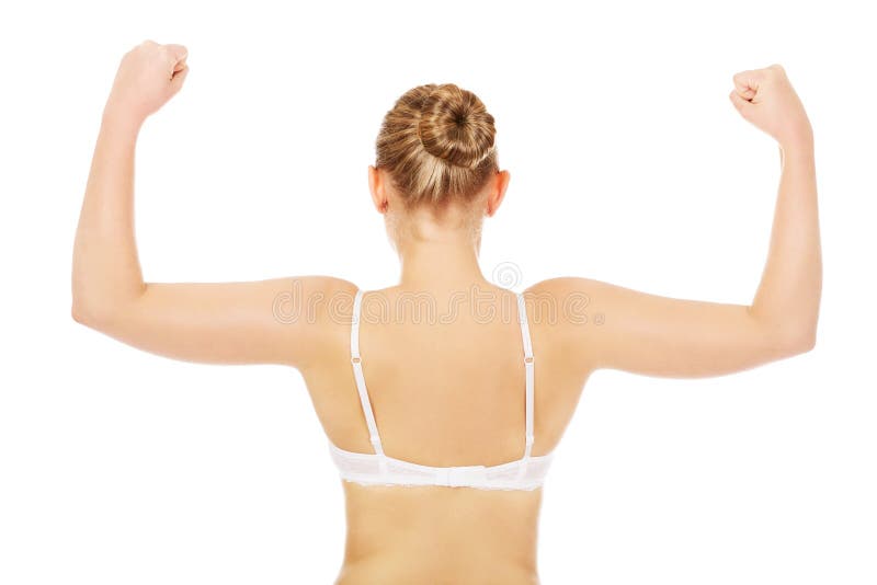 Back view of athletic woman show her muscles royalty free stock photo