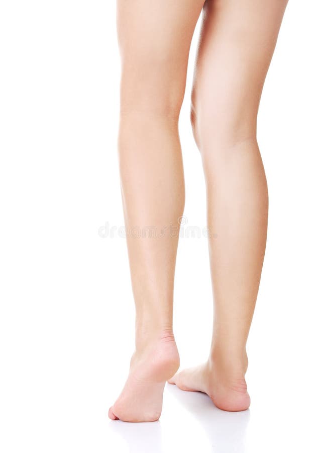 Back view of beautiful slim female legs stock photos
