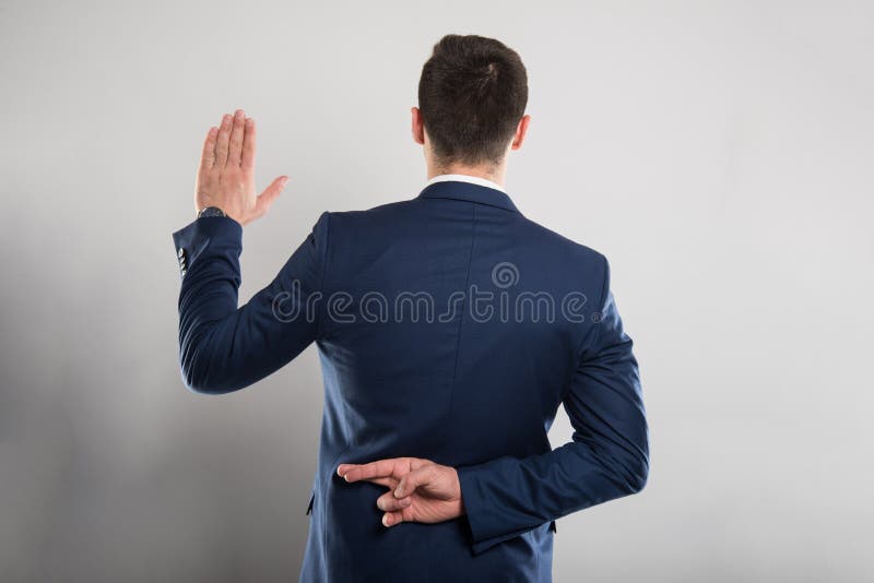 Back view of business man taking fake oath gesture stock image