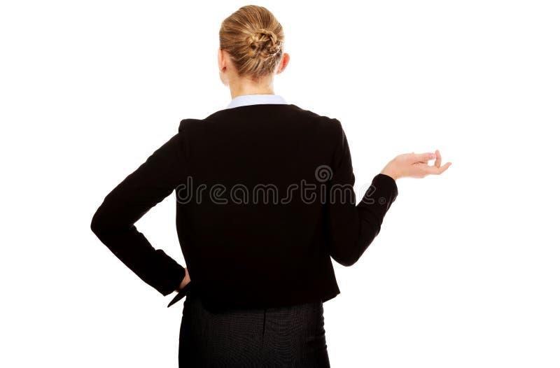 Back view of business woman shrugging with I dont know gesture royalty free stock photos