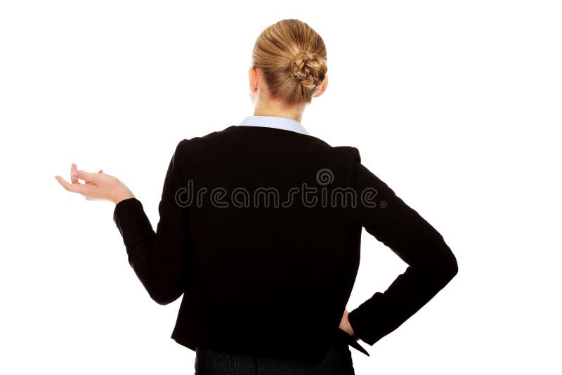 Back view of business woman shrugging with I dont know gesture stock photo