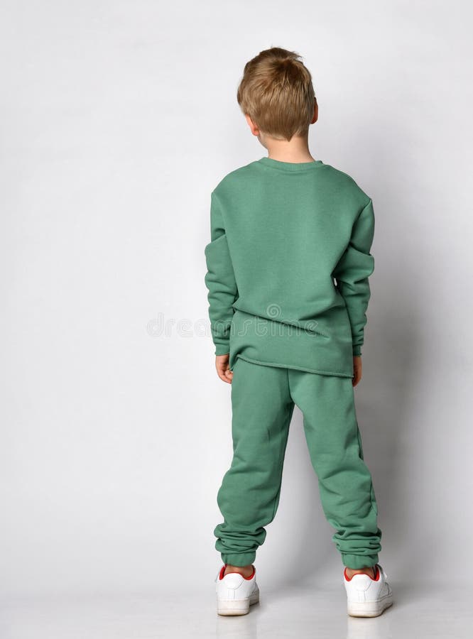 Cute Active Little Boy in Trendy Sports Green Clothes Standing with ...