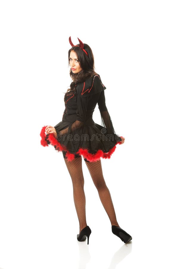 Back view of devil woman turns to the camera stock image