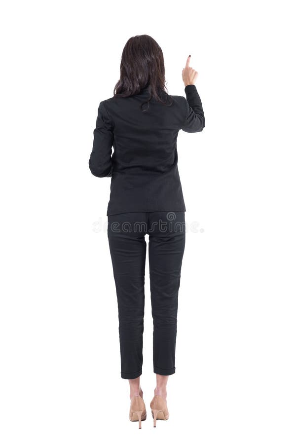 Back view of elegant teacher or businesswoman pointing right hand pushing button on touch screen.