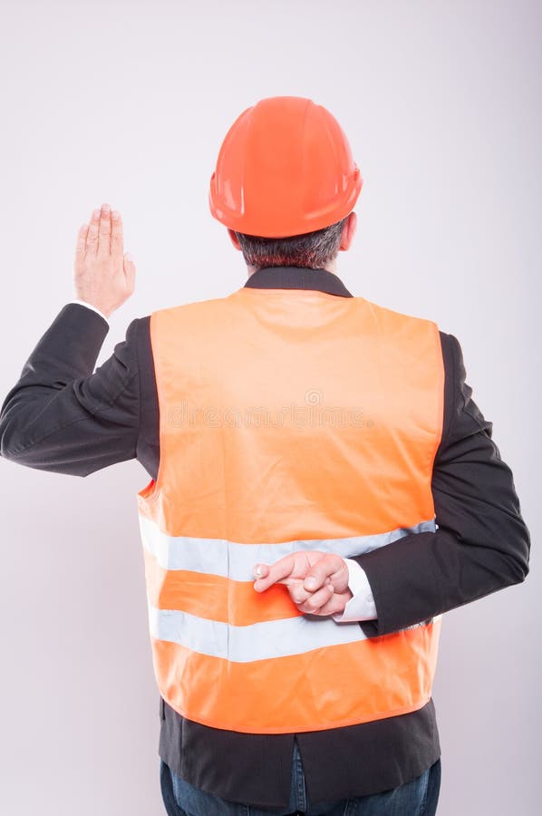 Back view of engineer making fake oath gesture royalty free stock images