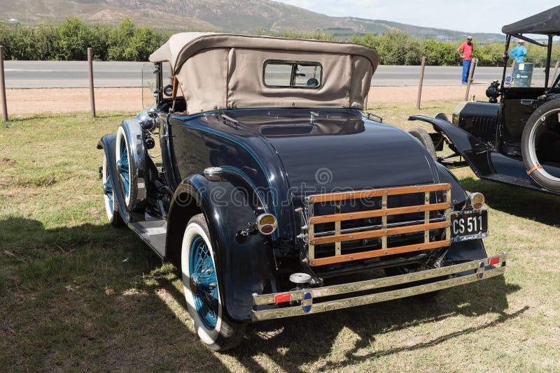 VILLIERSDORP, SOUTH AFRICA - APRIL 12, 2021: Back view of a black Ford Model A deluxe roadster from 1931. VILLIERSDORP, SOUTH AFRICA - APRIL 12, 2021: Back view of a black Ford Model A deluxe roadster from 1931