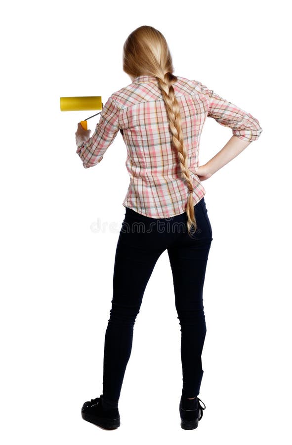 Back view of a girl who paints the paint roller. rear view people collection. backside view of person. Isolated over white background. Put his hand into the side of the girl paints a wall