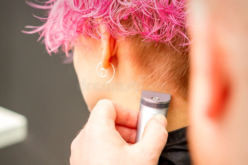 Back View of Hairdresser& X27;s Hand Shaving Nape and Neck with Electric  Trimmer of Young Caucasian Woman with Short Pink Stock Photo - Image of  caucasian, business: 222195920