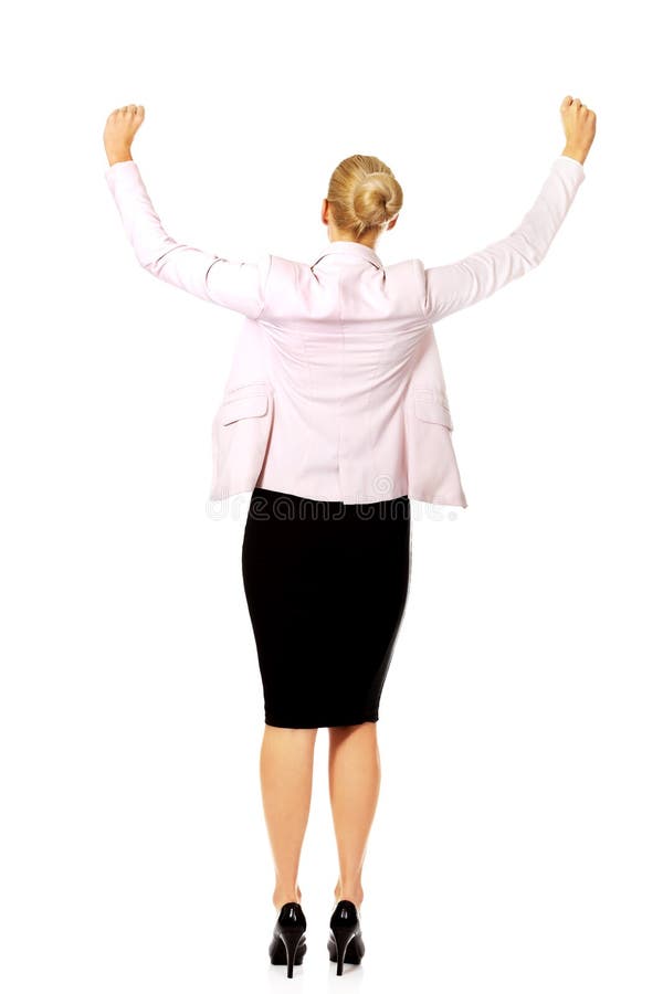 Back view of happy business woman with arms up royalty free stock photos